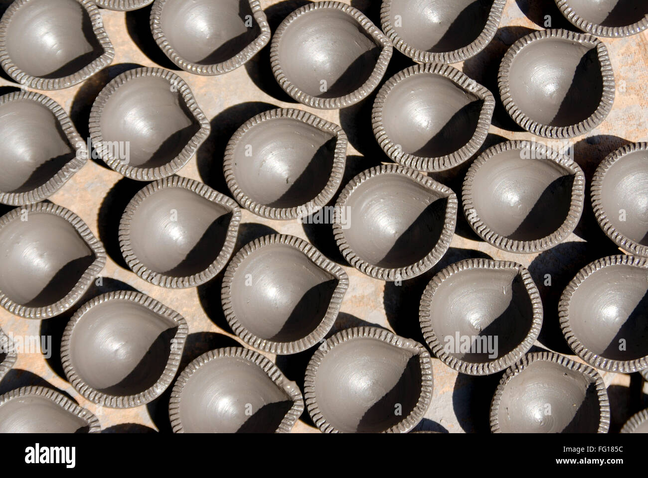 Oil lamps made of mud drying Stock Photo