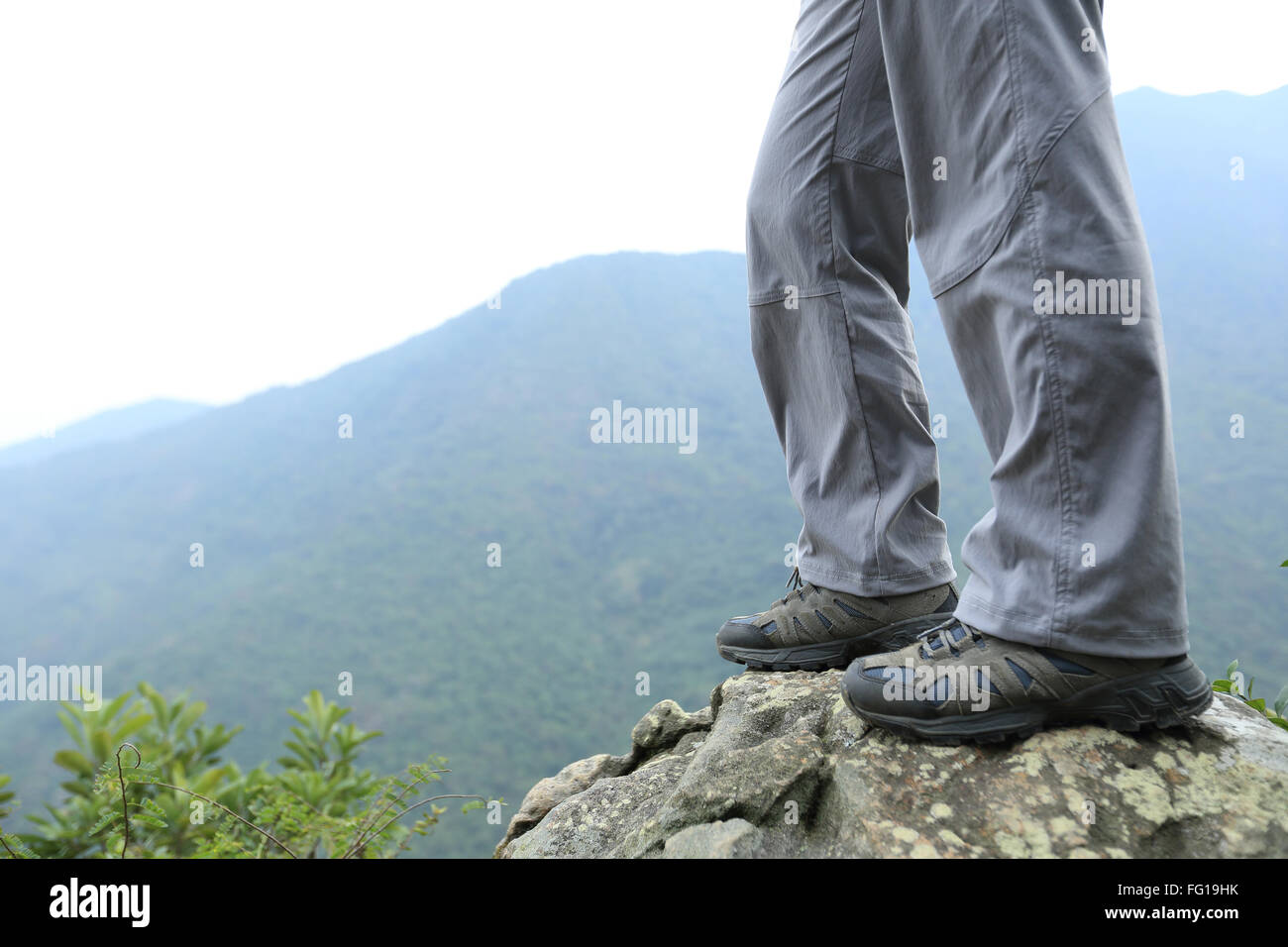 young woman hiker hiking at mountain peak Stock Photo - Alamy