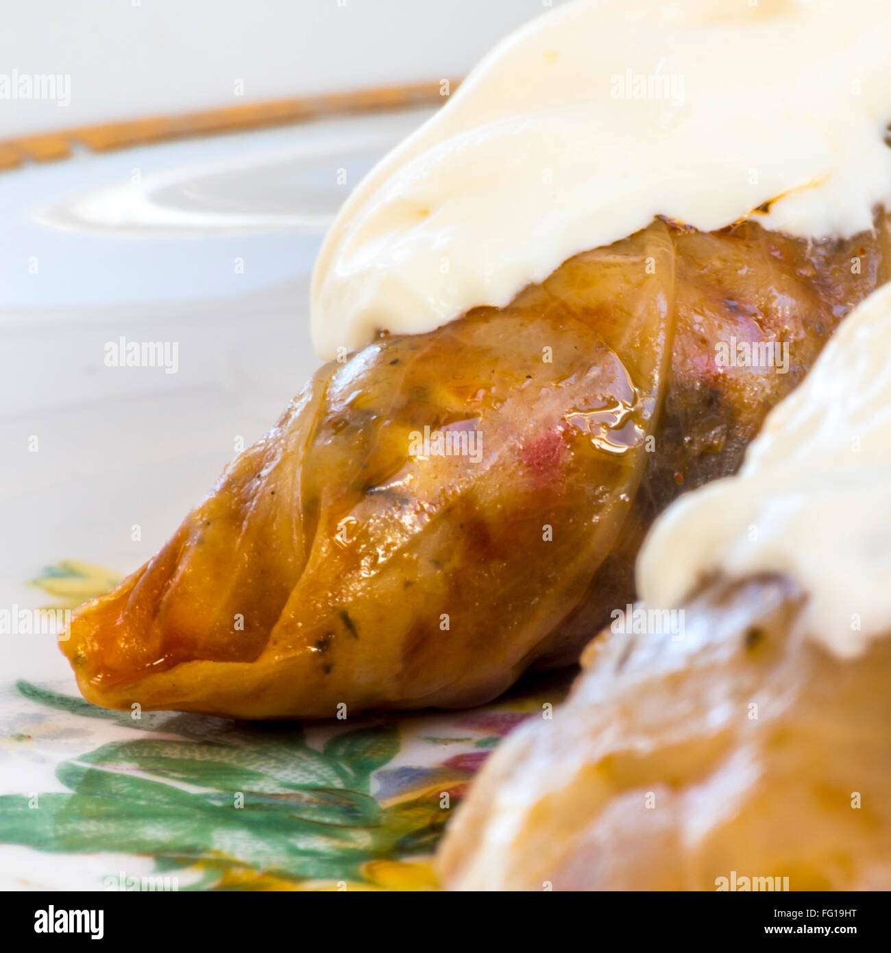 Traditional Romanian cabbage rolls with cream on top Stock Photo