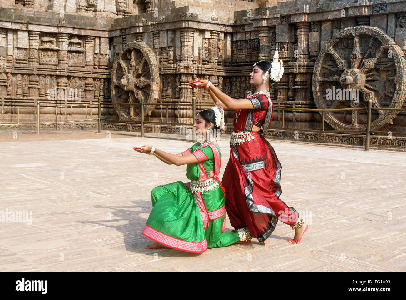 Dancers performing classical traditional odissi dance at Konarak Sun temple Konarak Orissa India - Model Release # 736C & 736D Stock Photo