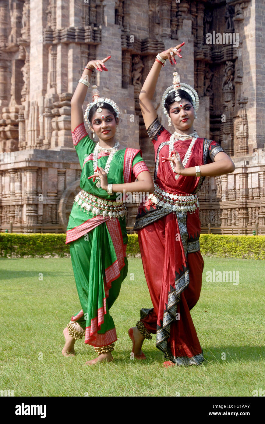 Dancers performing classical traditional odissi dance at Konarak Sun temple , Konark , Orissa , Odisha ; India ; Asia ; MR#736C,736D Stock Photo