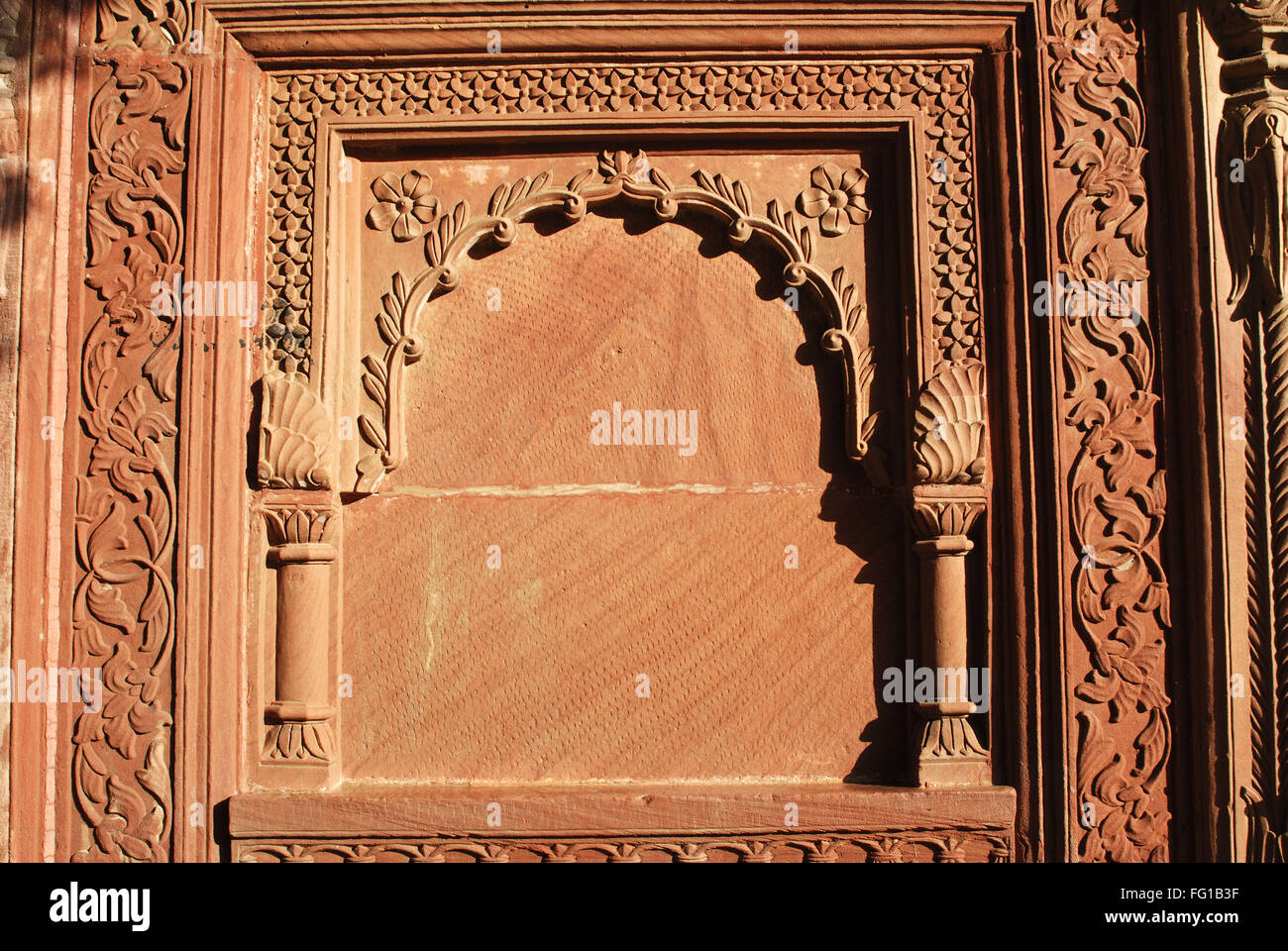 Beautiful carving on red stone inside fort , Bikaner , Rajasthan , India Stock Photo