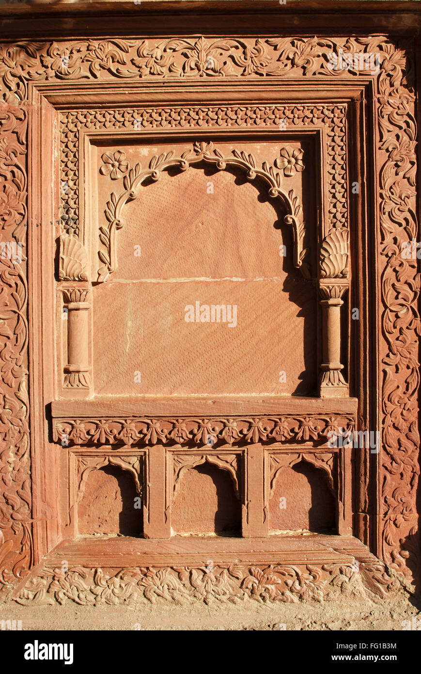 Carving on red stone inside fort , Bikaner , Rajasthan , India Stock Photo