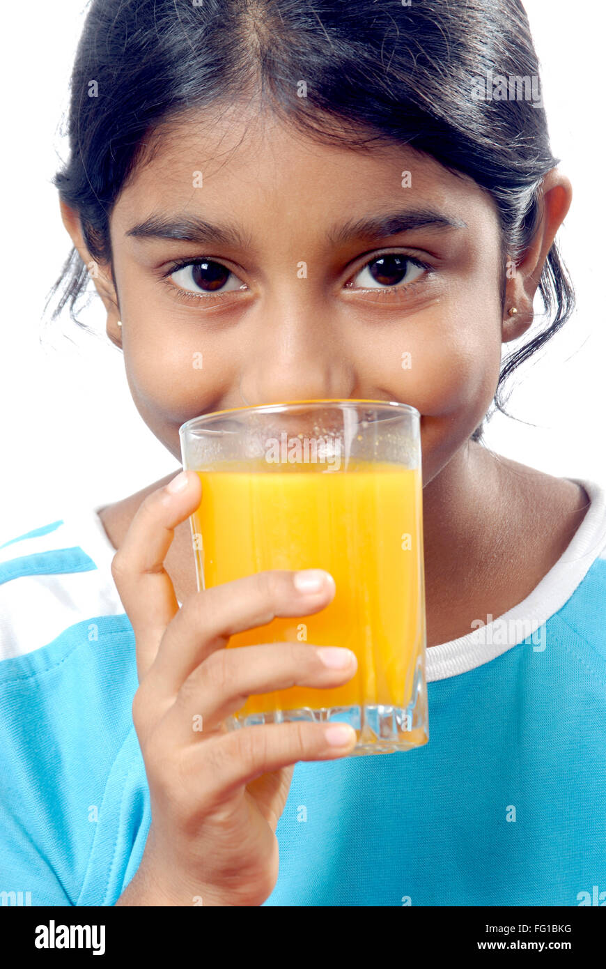 Young girl in action of drinking mango juice MR#152 Stock Photo - Alamy
