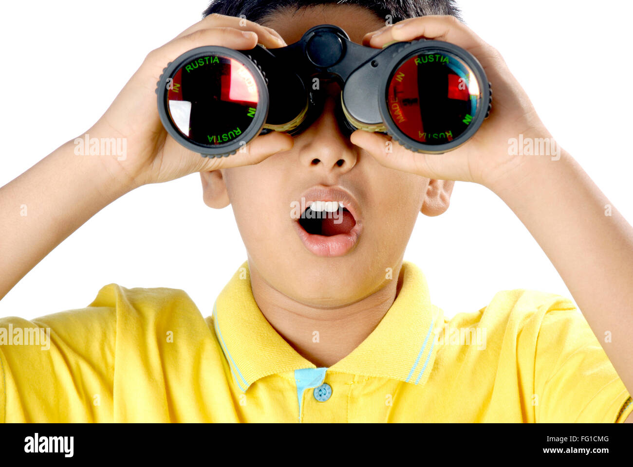 Young boy looking through binocular seeing wonder and surprising