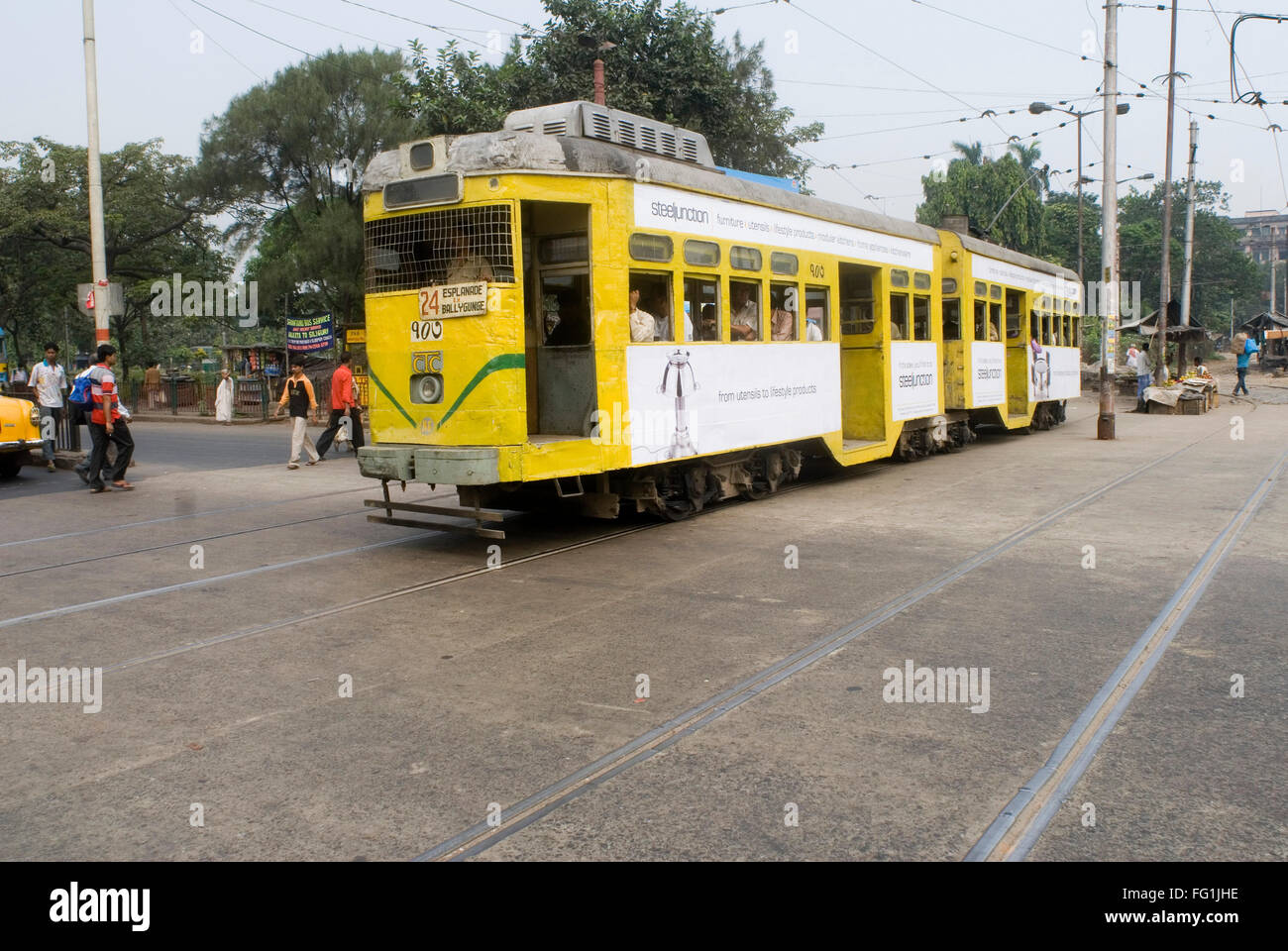 Yellow Tram On the Street of Kolkata , West Bengal , India Stock Photo