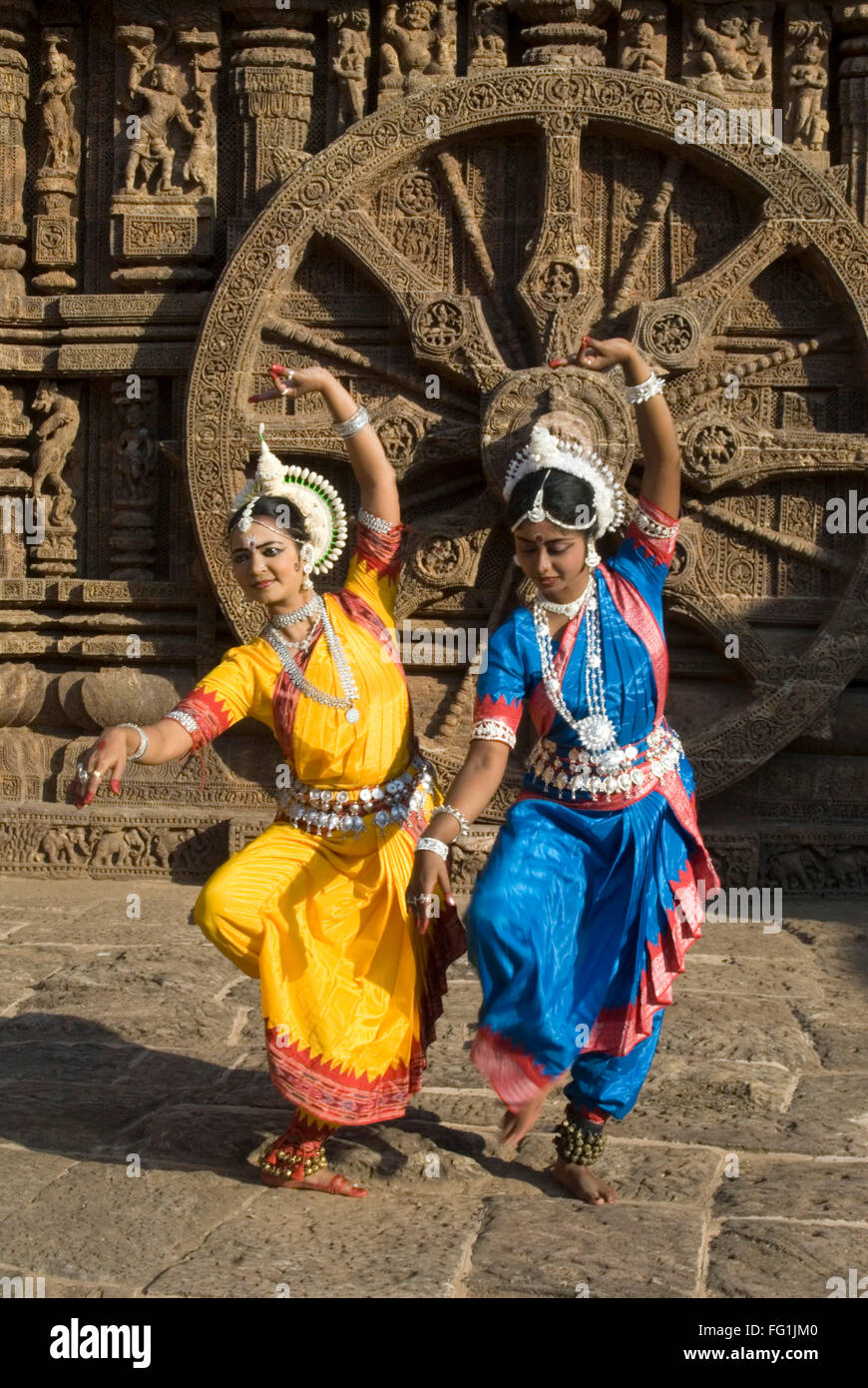 Odissi dancers strike pose re enacts Indian myths such Ramayana front iconic Sun Chariot Sun temple complex Konarak Orissa Stock Photo