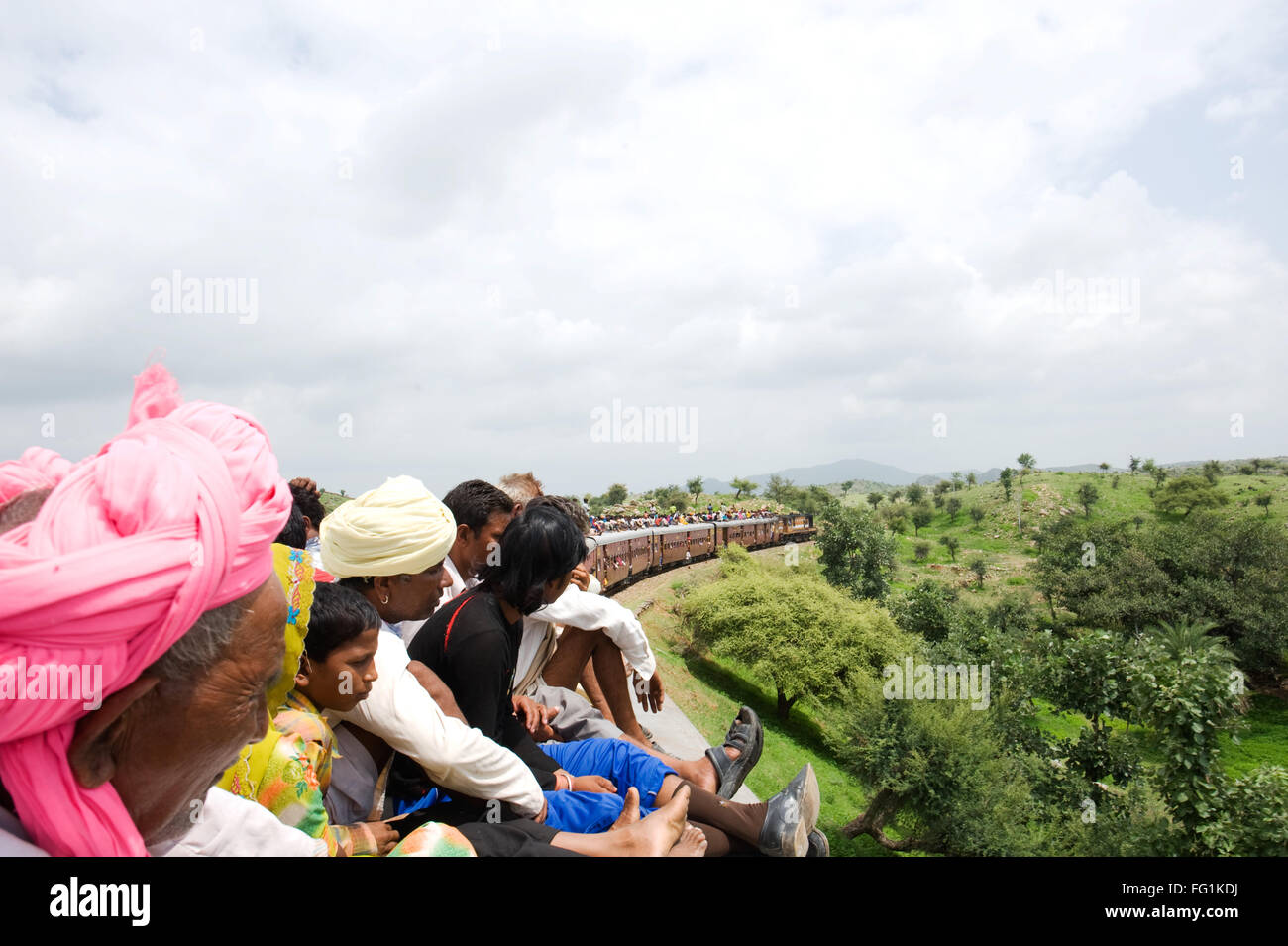 People sitting on train roof ; Rajasthan ; India NOMR Stock Photo