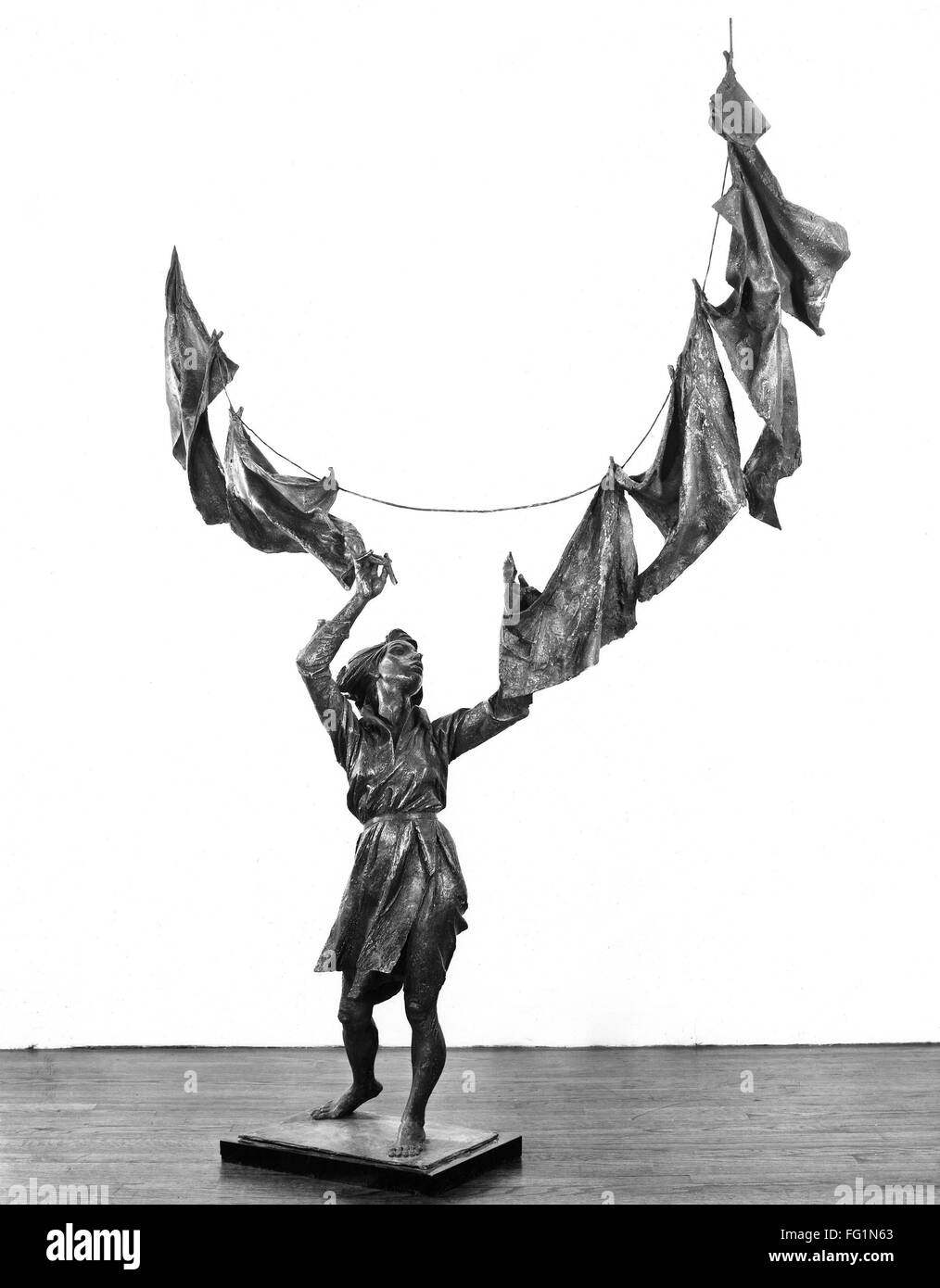 LUCCHESI: SCULPTURE, 1967. /n'Woman Hanging Clothes.' Bronze sculpture by Bruno  Lucchesi, 1967. Height: 81 inches. EDITORIAL USE ONLY Stock Photo - Alamy