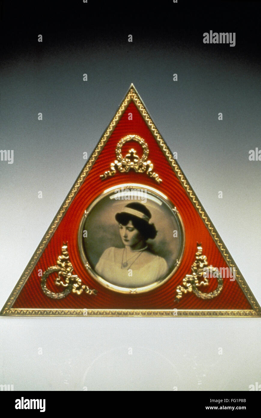 FABERGE FRAME, 18961908. /nFaberge triangular picture frame, with