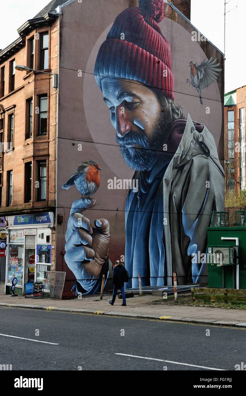 Glasgow, UK. 17th Feb, 2016. A new mural by Australian street artist Smug emerges on High Street, Glasgow, the latest in a series of urban art to adorn the city's walls. Credit:  Tony Clerkson/Alamy Live News Stock Photo