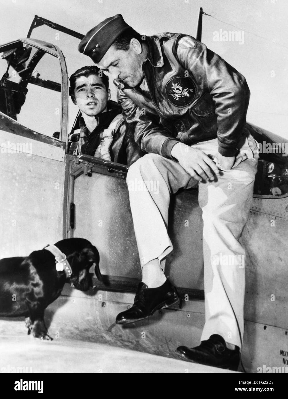 CLAIRE LEE CHENNAULT /n(1893-1958). American military aviator. Photographed  sitting on the side of a fighter plane's cockpit, with Captain Burton  Rodier and a dachshund, c1941 Stock Photo - Alamy