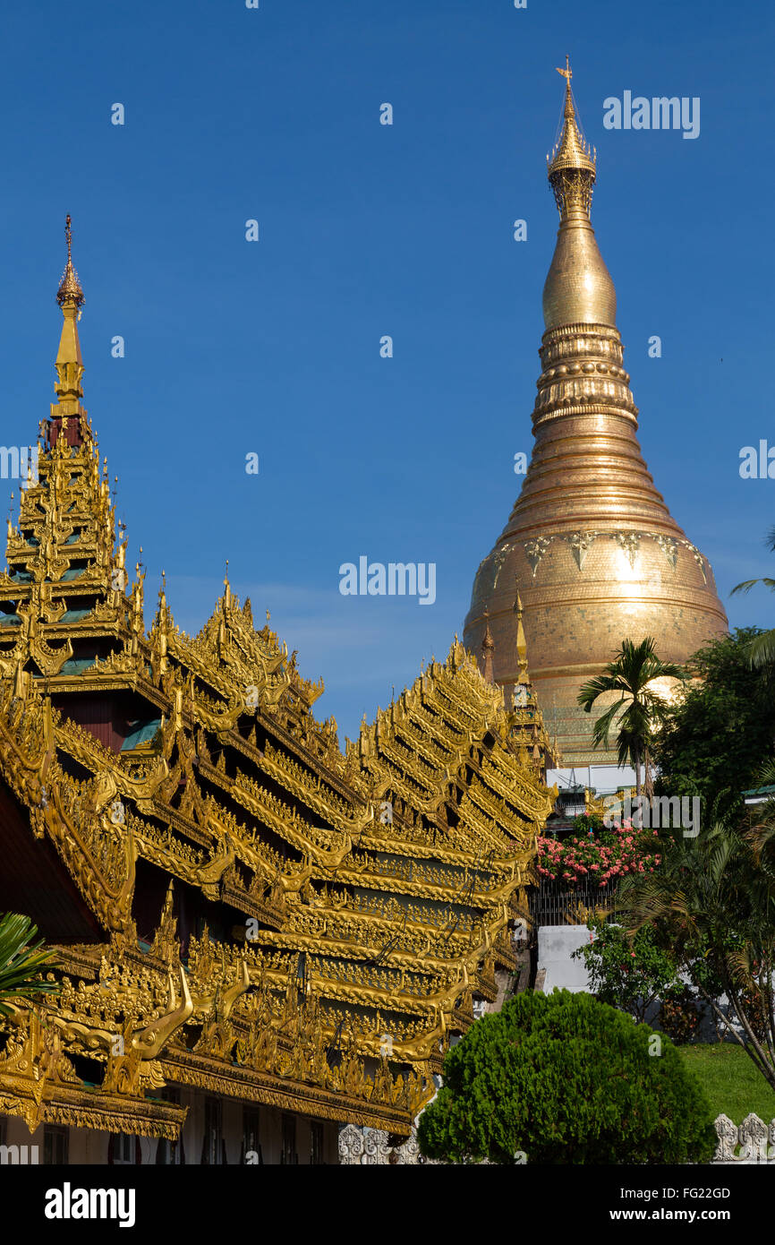 The Shwedagon pagoda showing the highly decorated covered approach - portrait landscape Stock Photo