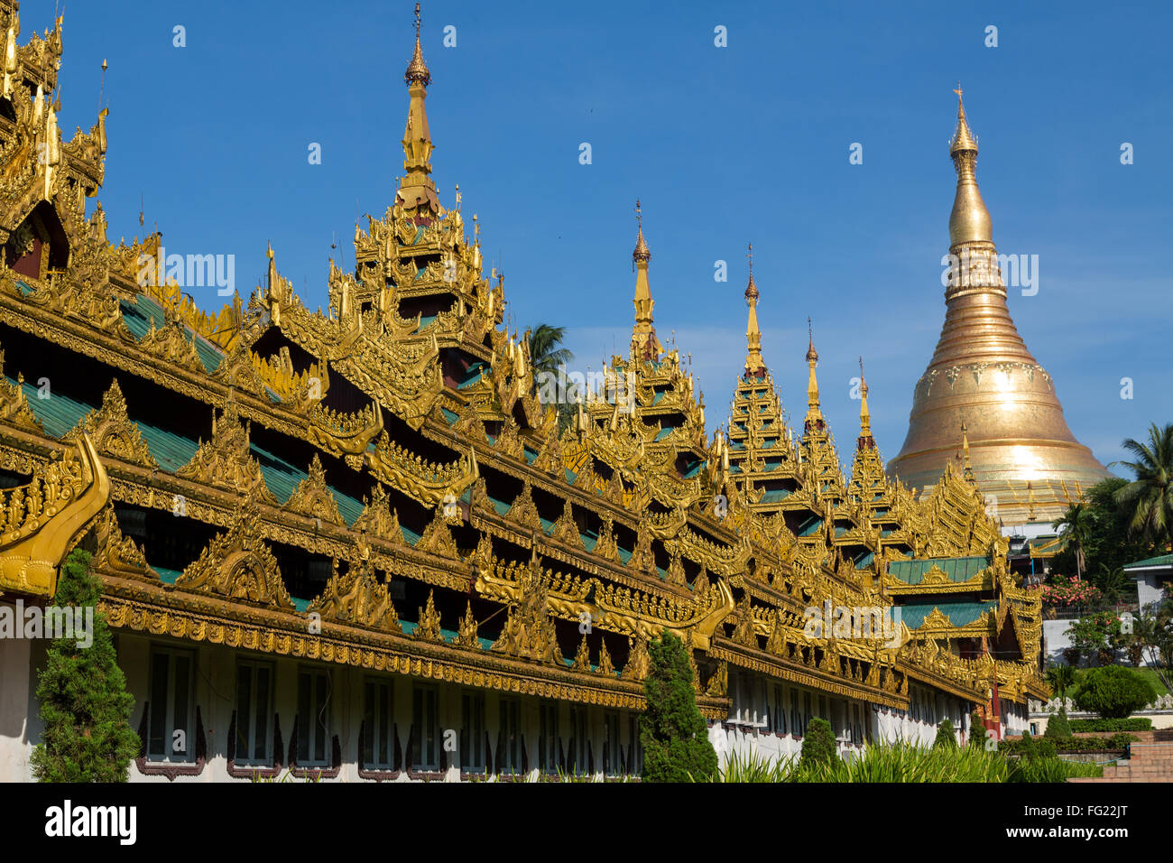 The Shwedagon pagoda showing the highly decorated covered approach - landscape Stock Photo