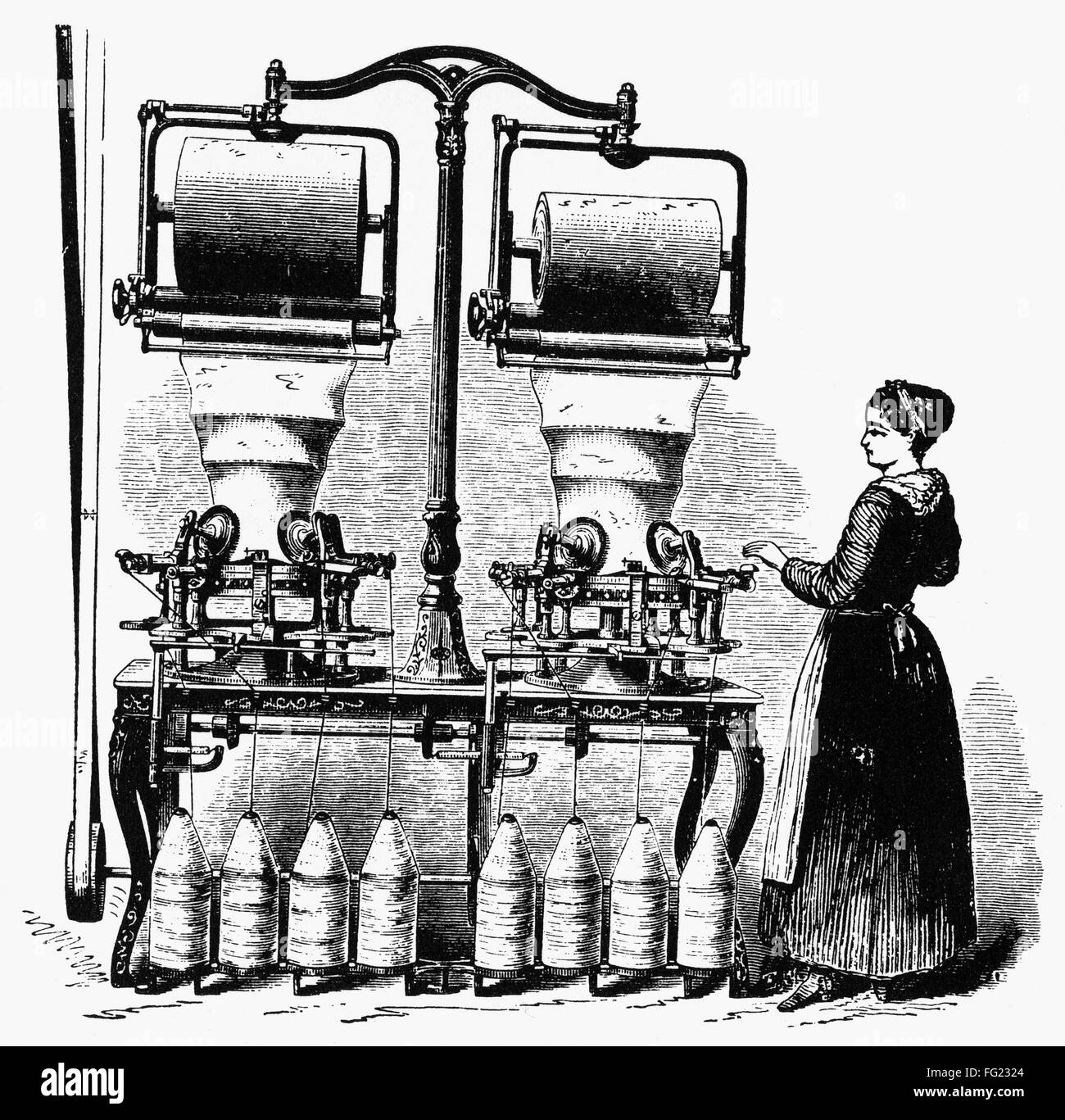 TEXTILES KNITTING MACHINE. /nA woman working at an upright rotary