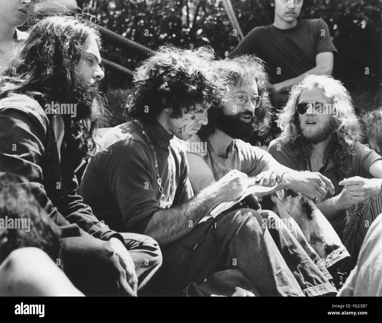 HIPPIE MOVEMENT, 1970. /nA group of hippies listen to music outdoors at