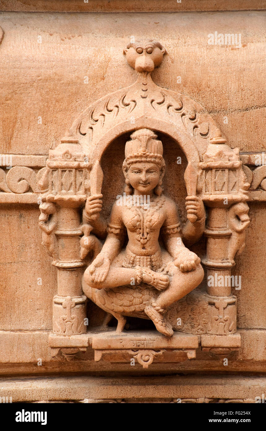 Sculpture of goddess sitting on peacock on the wall of panchasara parasvanath jain temple ; Patan ; Gujarat ; India Stock Photo