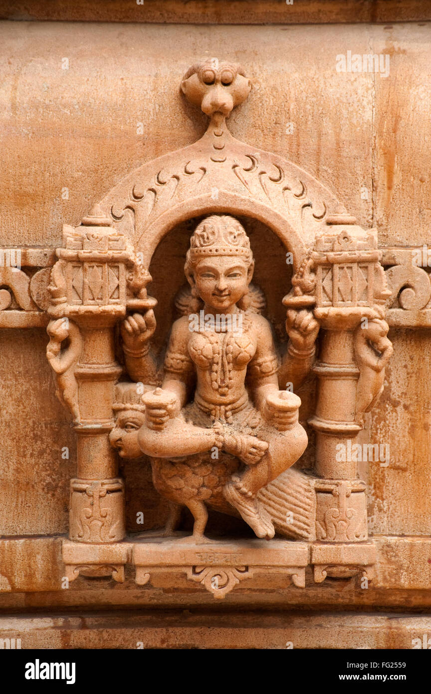 Sculpture of goddess chakreshwari sitting on a eagle on the wall of panchasara parasvanath jain temple ; Patan ; Gujarat Stock Photo