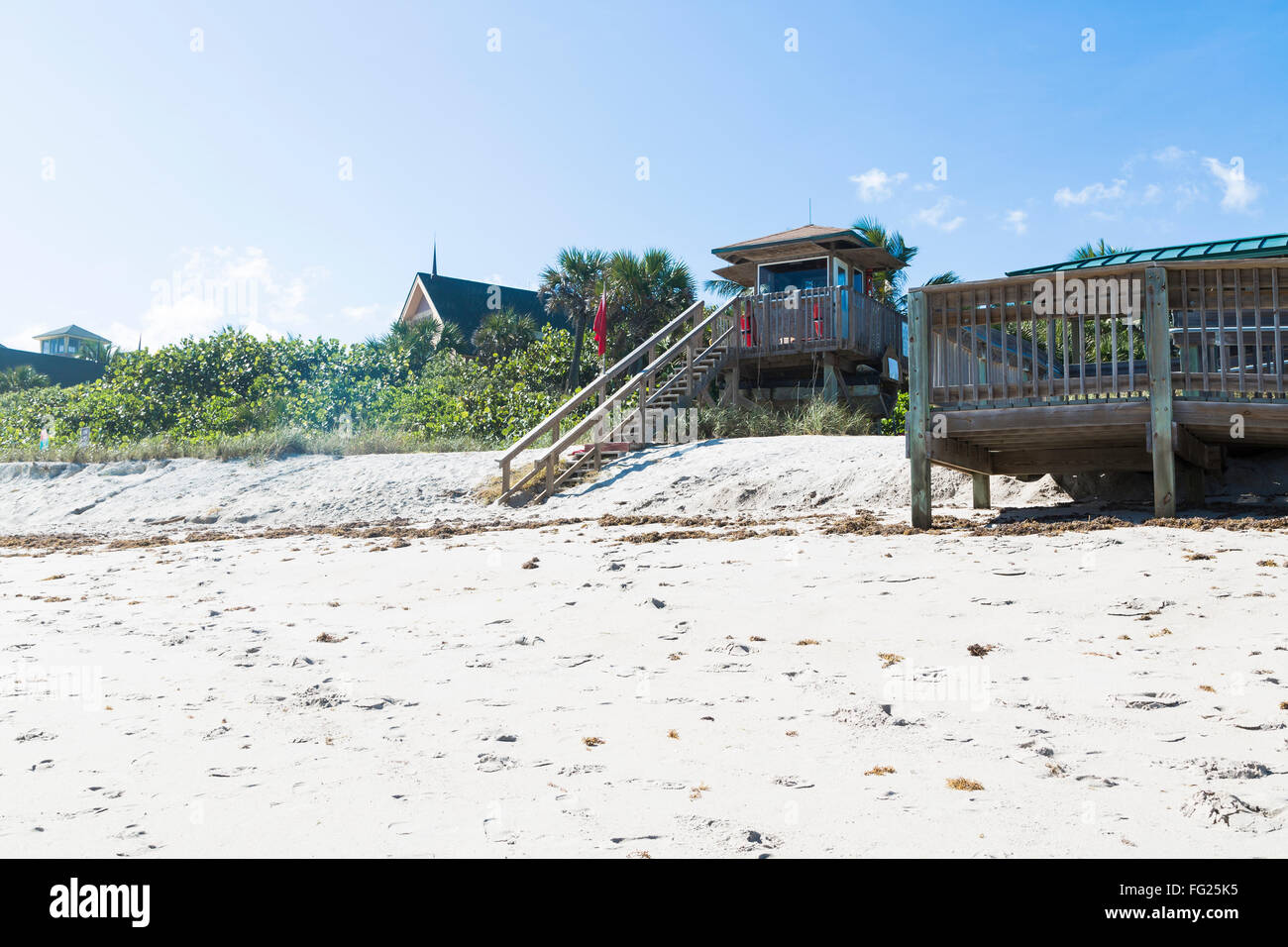 Green beach chairs and blue summer beach house, Florida Stock Photo