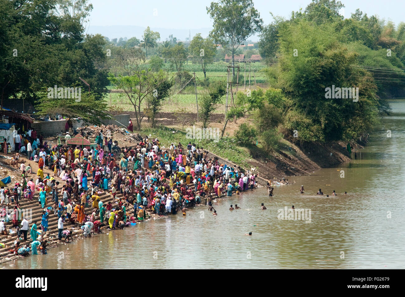 People taking bath in ghataprabha  river at hukkeri ; Belgaum ; Karnataka ; India Stock Photo