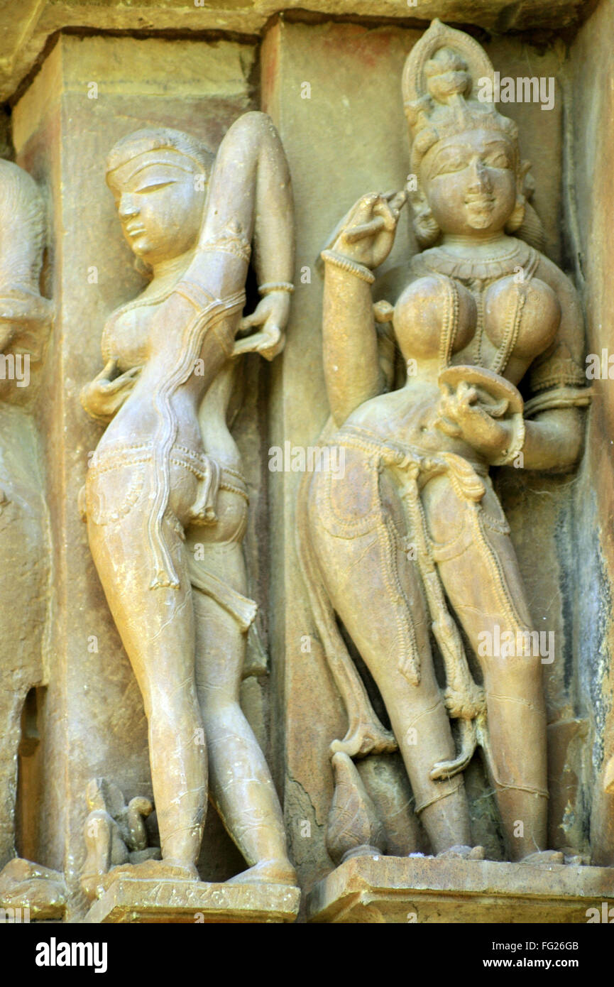 Apsara and Nayika scratching back, Vishvanath Temple,  Khajuraho, Madhya Pradesh, India, Asia Stock Photo