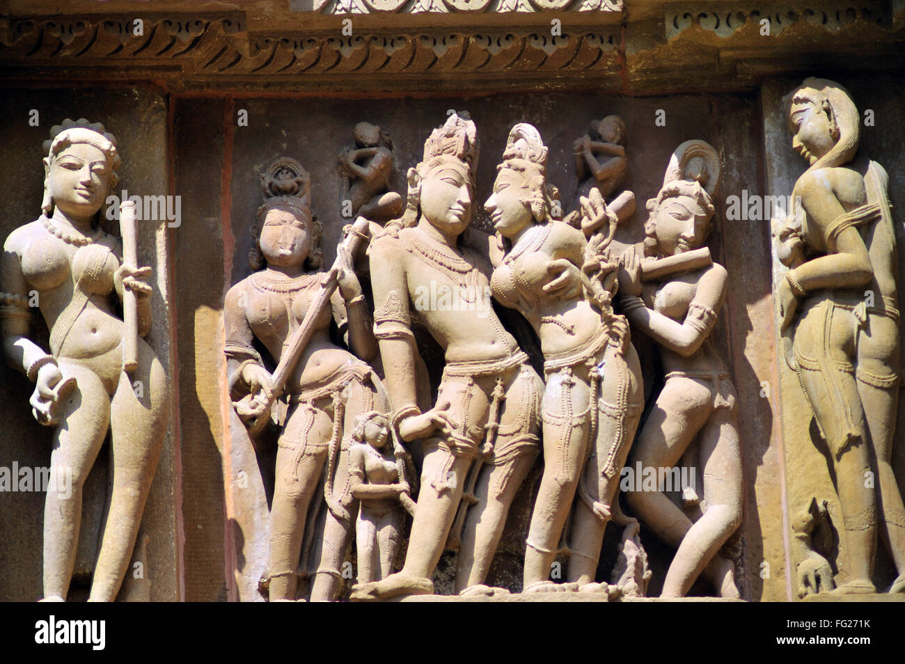 Khajuraho ornate carved sculptures on wall of lakshmana temple madhya