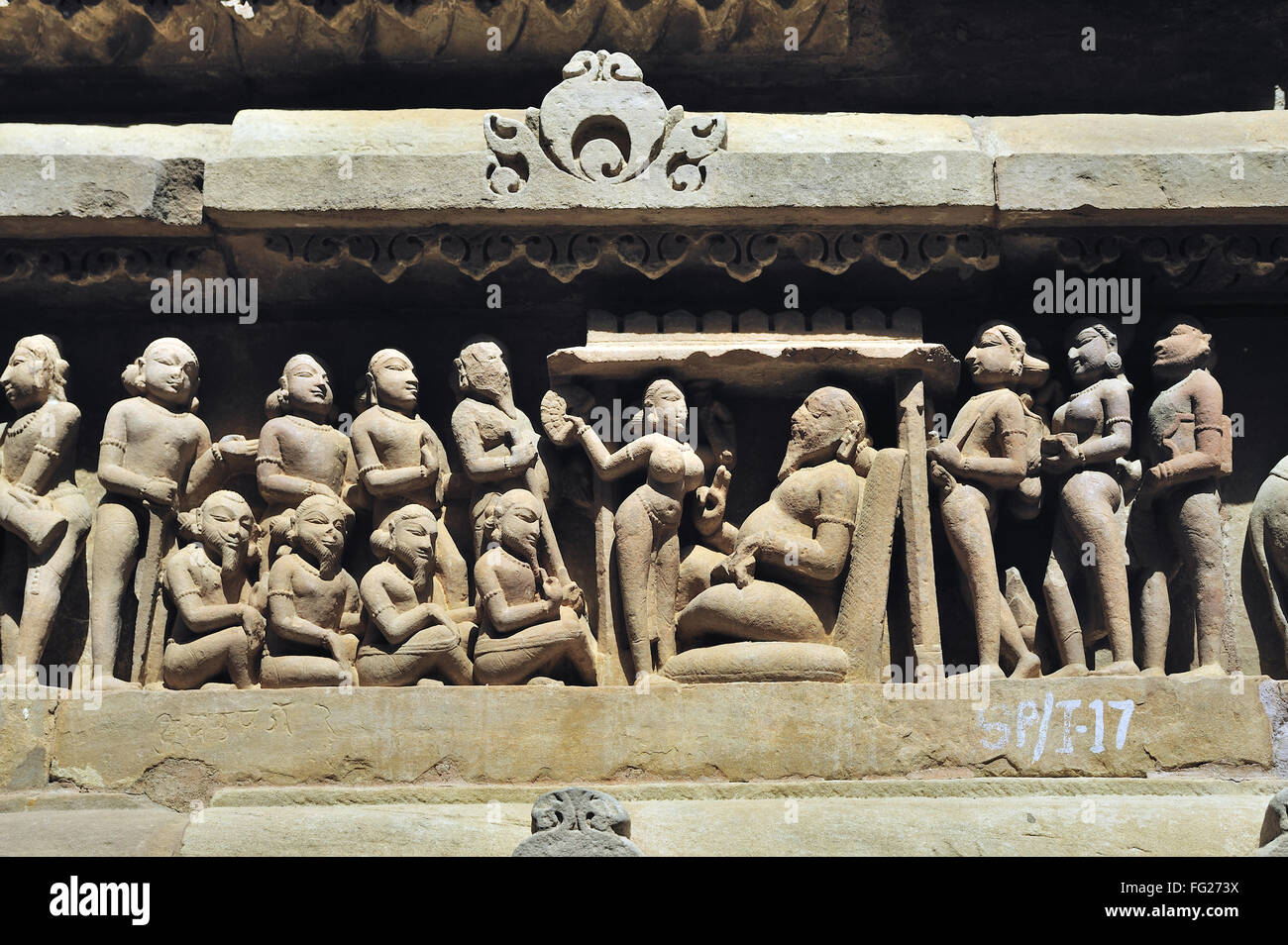 Khajuraho authority with acolytes on lakshmana temple madhya pradesh India Stock Photo