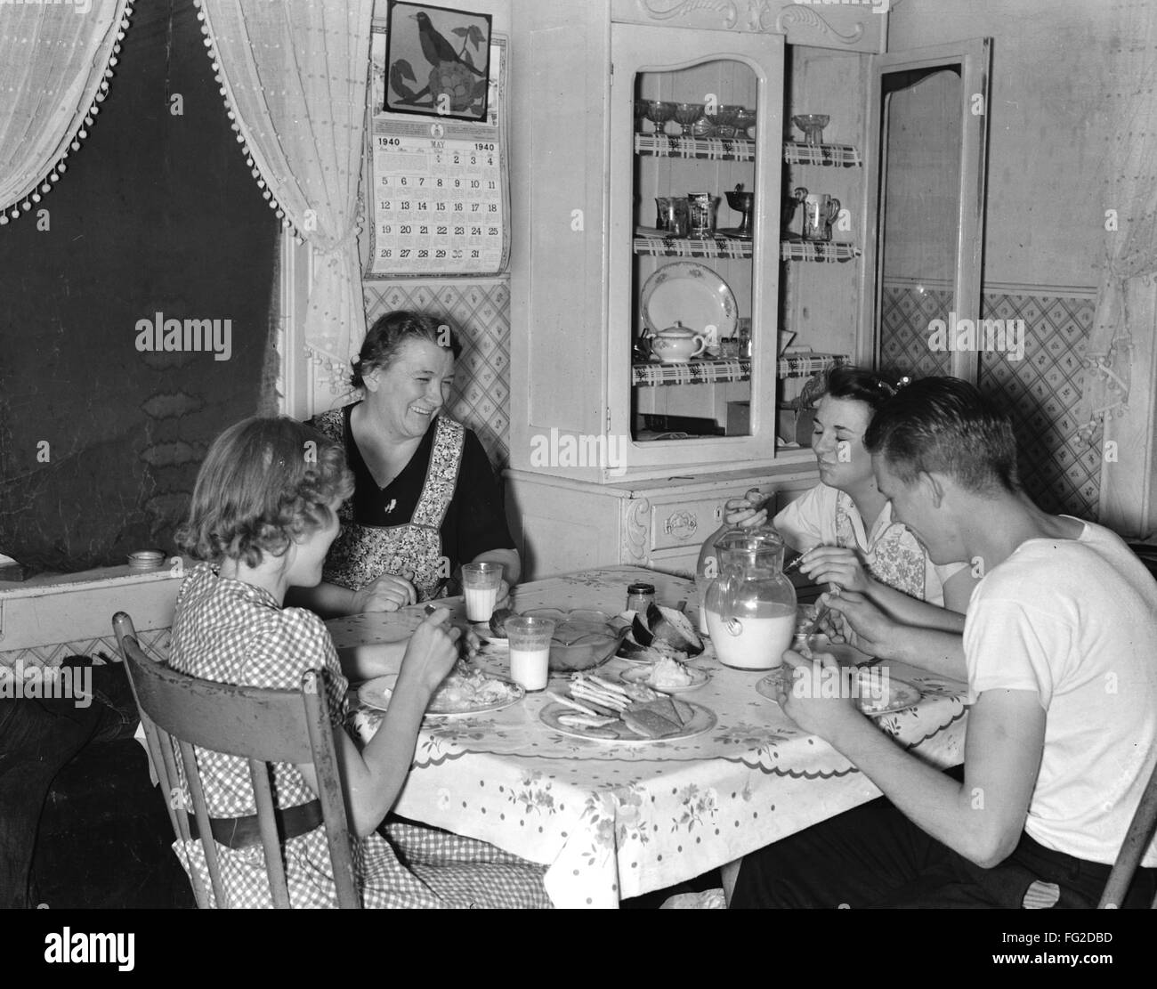 UTAH: DINNER, 1940. /nThe family of Mrs. Marinus W. Hansen having dinner at home in Box Elder County, Utah. Photograph, 1940. Stock Photo