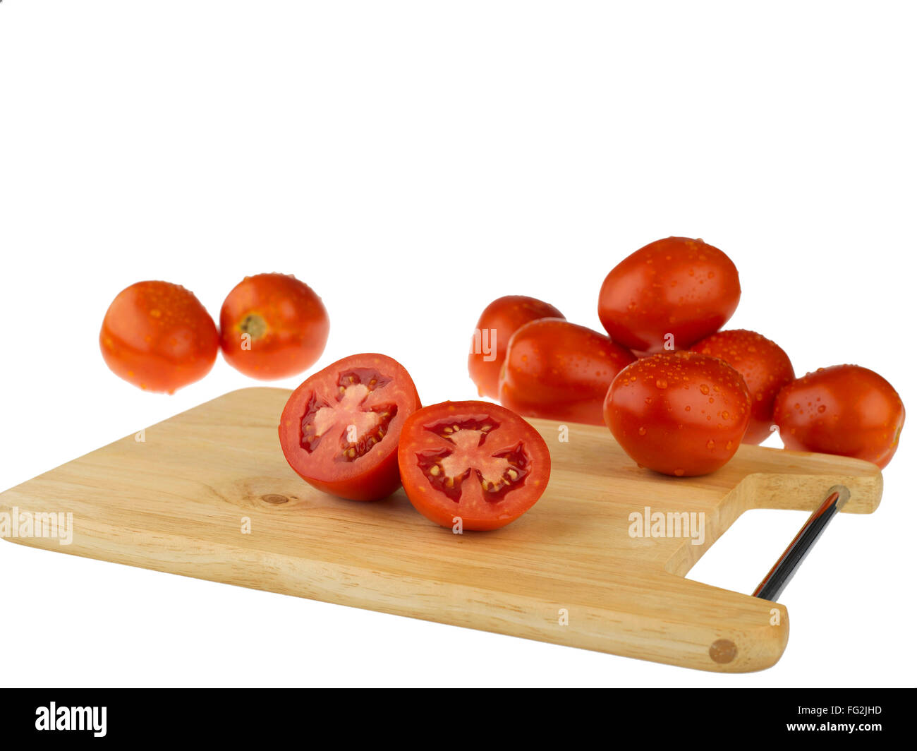 Vegetables ; tomatoes with cutting board on white background Stock ...