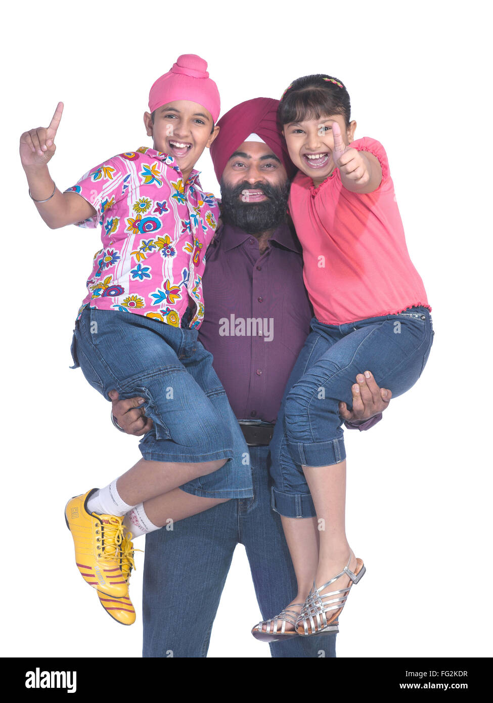 Sikh father carrying children in arms MR#702X;702Y;779A Stock Photo