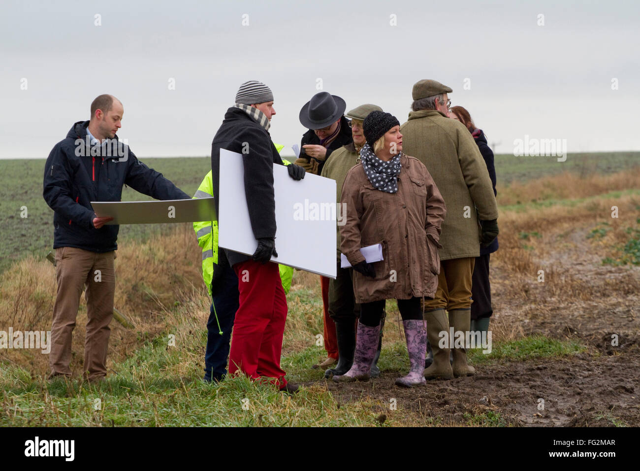 District councillors/councilors and council officers visit a farm