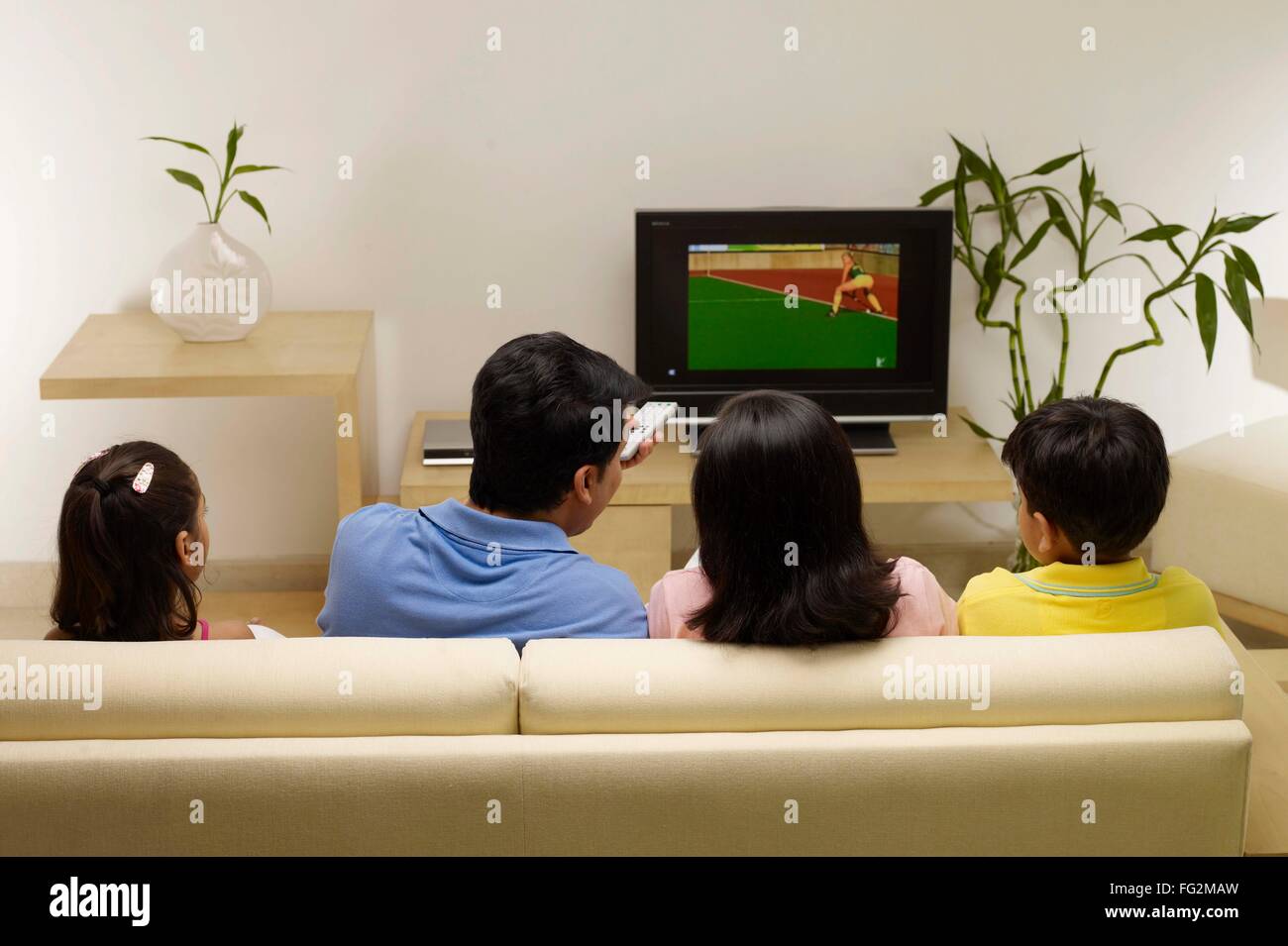 Children With Parents Watching Match On Tv Sitting In House Stock Photo Alamy Children With Parents Watching Match On Tv Sitting In House Stock Photo Alamy