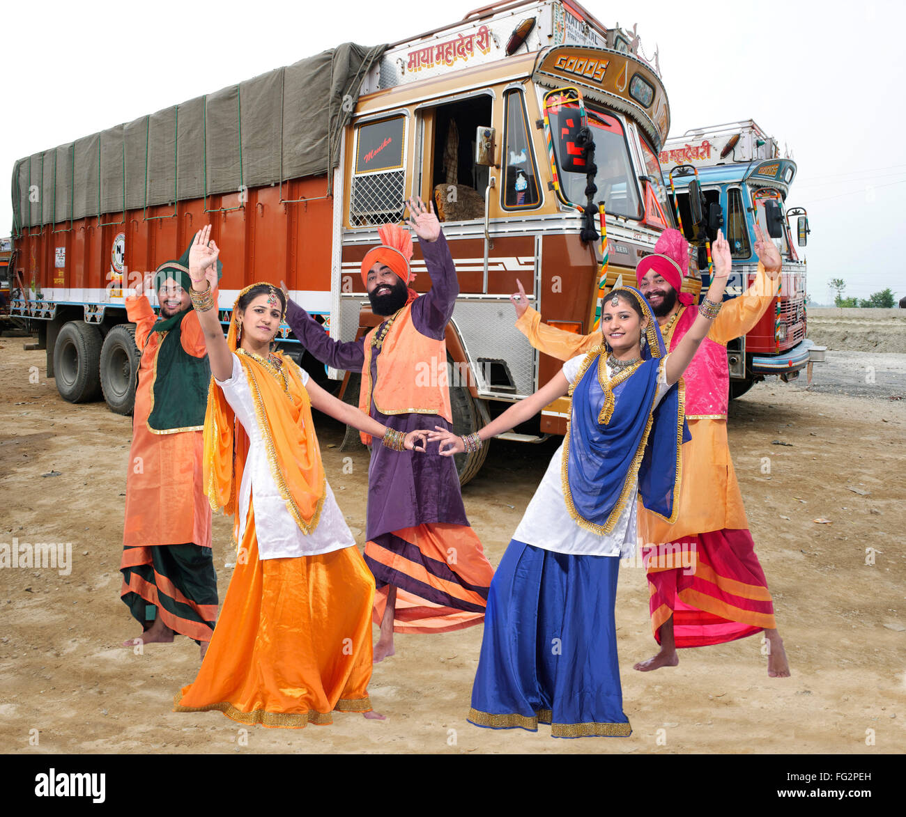 Dancers performing folk dance bhangra at lorries MR#779C;779B;779D;779E;779F Stock Photo