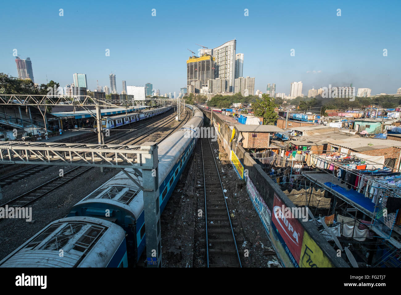 Railway lines and Central Mumbai's mix of slums and high rise buildings, India Stock Photo
