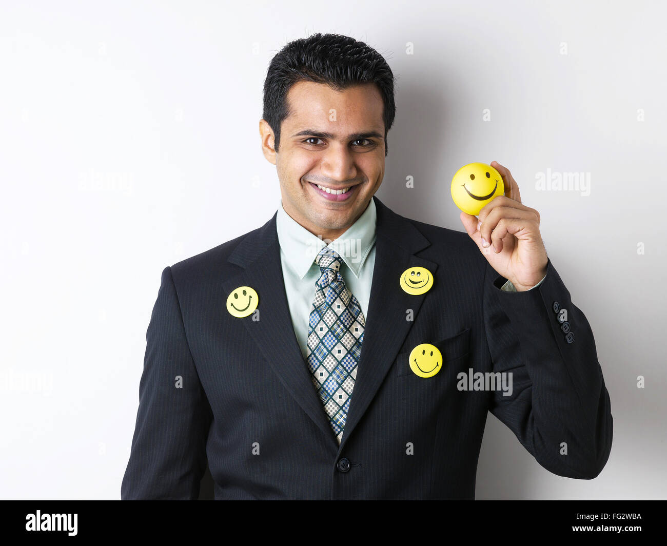 Smiley brooch on coat of  executive showing smiley ball MR#779K Stock Photo