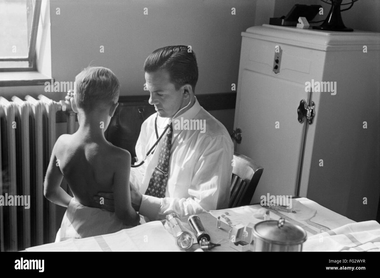 MARYLAND: DOCTOR, 1938. /nA doctor examining a child at preschool ...