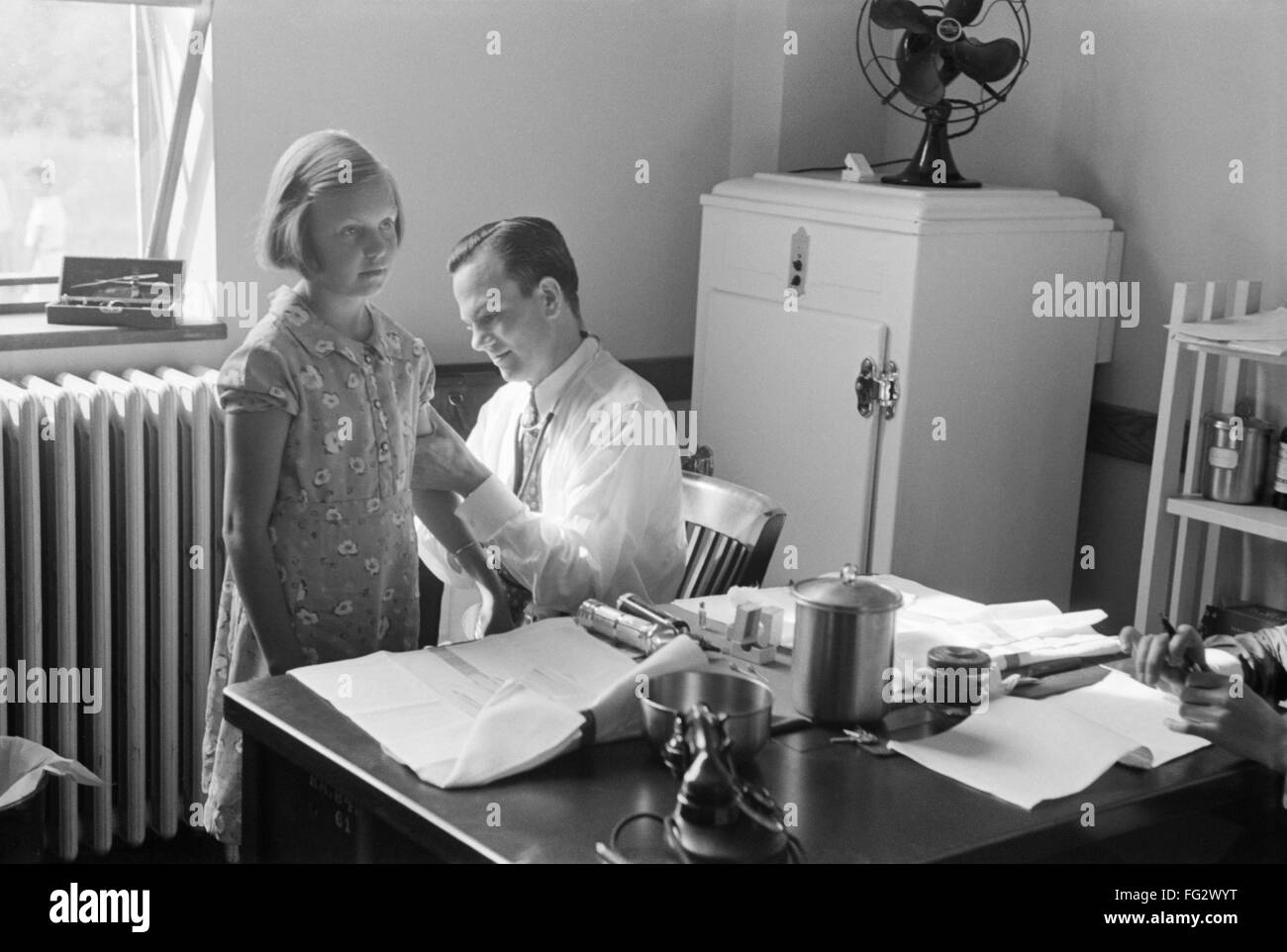 MARYLAND: DOCTOR, 1938. /nA doctor examining a child at preschool ...