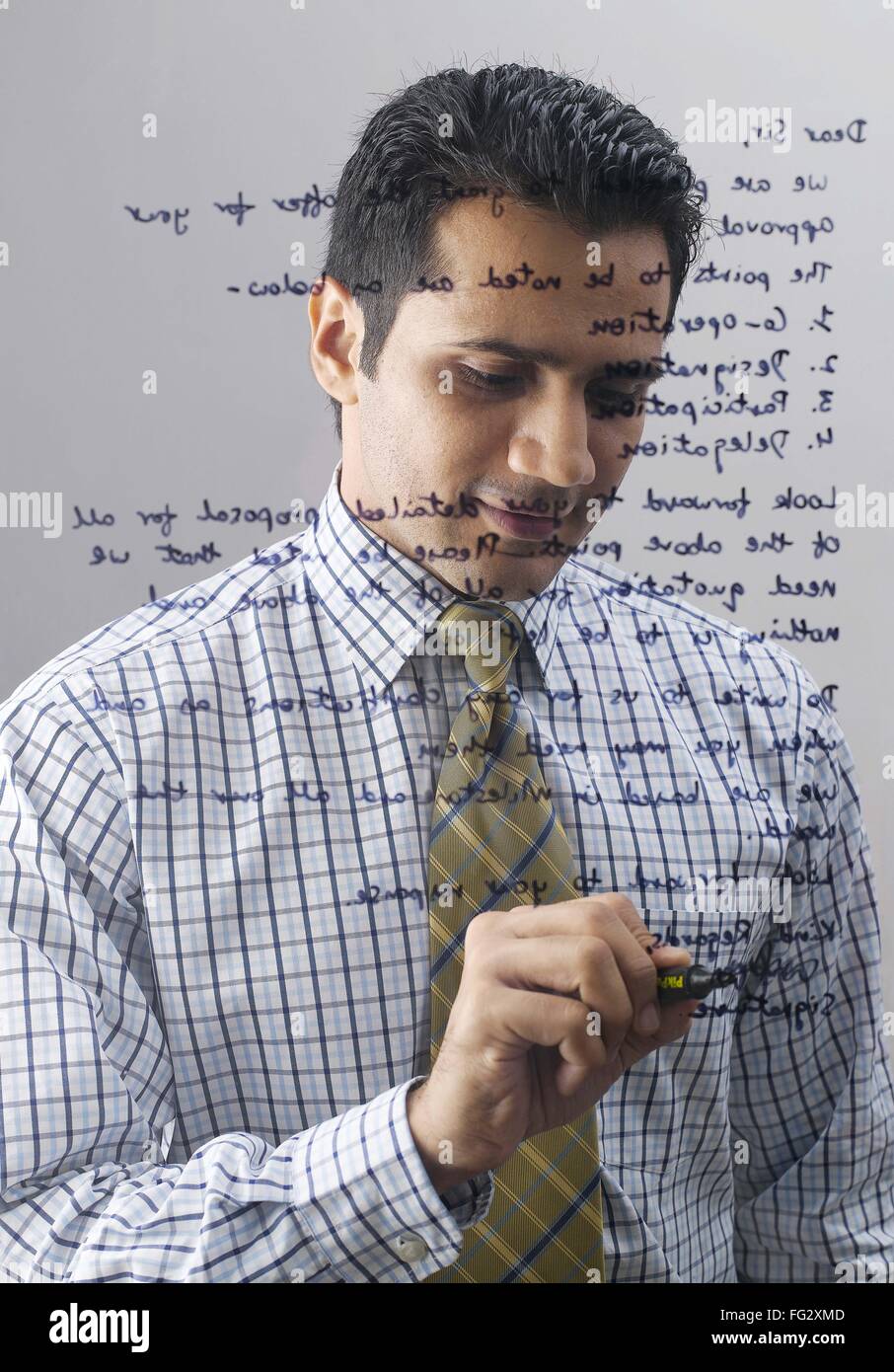 Executive writing on glass MR779K Stock Photo Alamy