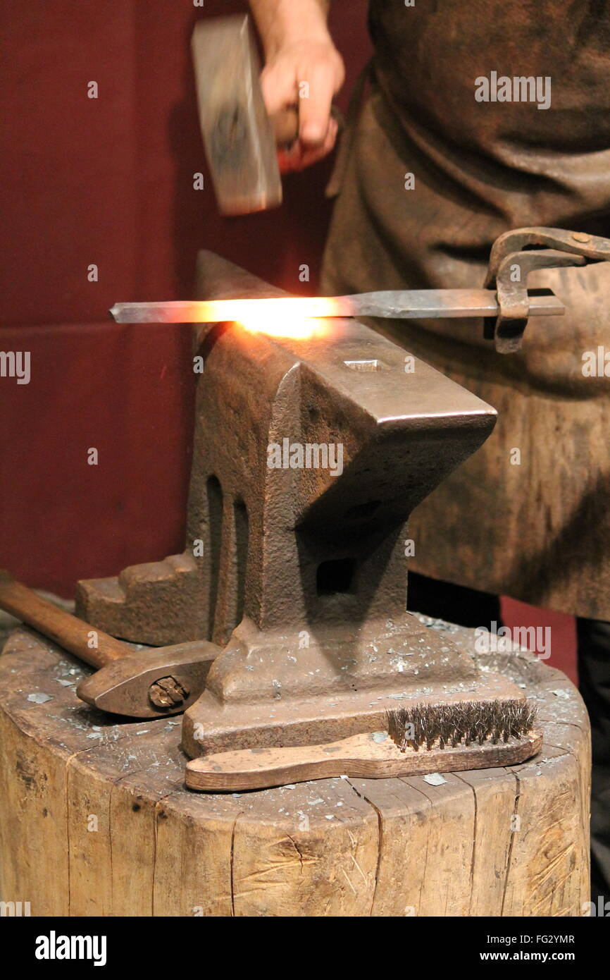 Anvil Working Blacksmith working on metal on anvil at forge high speed detail shot ...