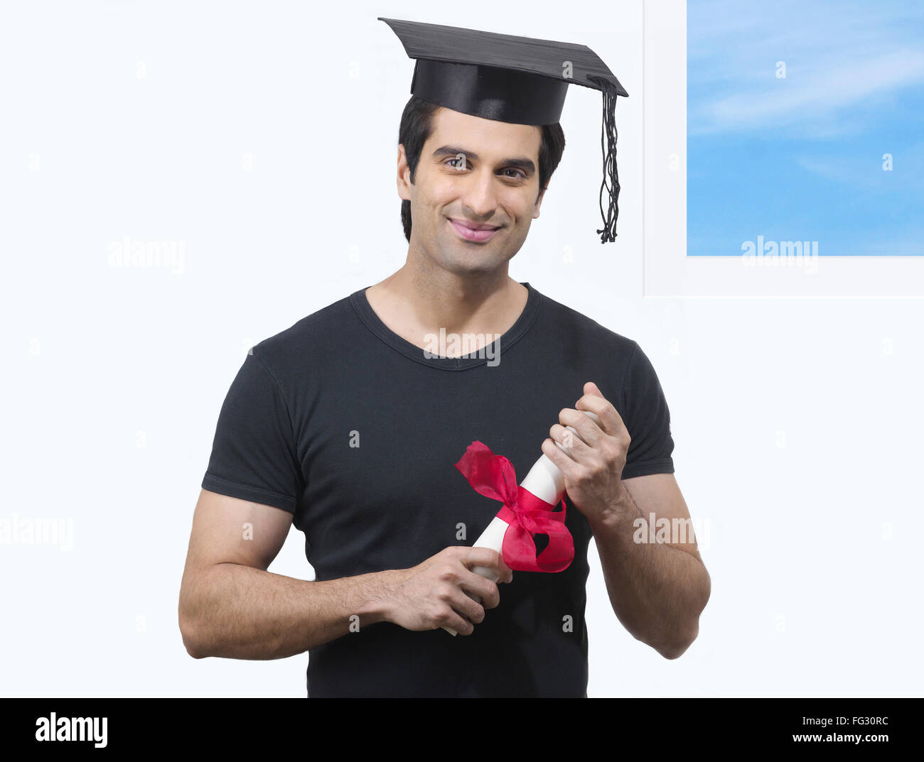 Man holding degree certificate ; MR#779L Stock Photo