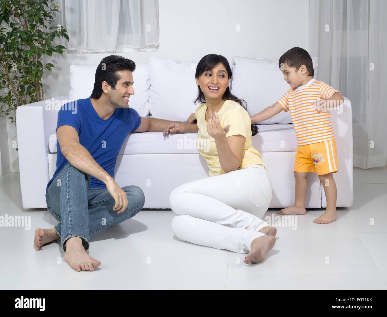 baby pulling his mother hair ; MR779L ; MR779M ; MR779O Stock Photo