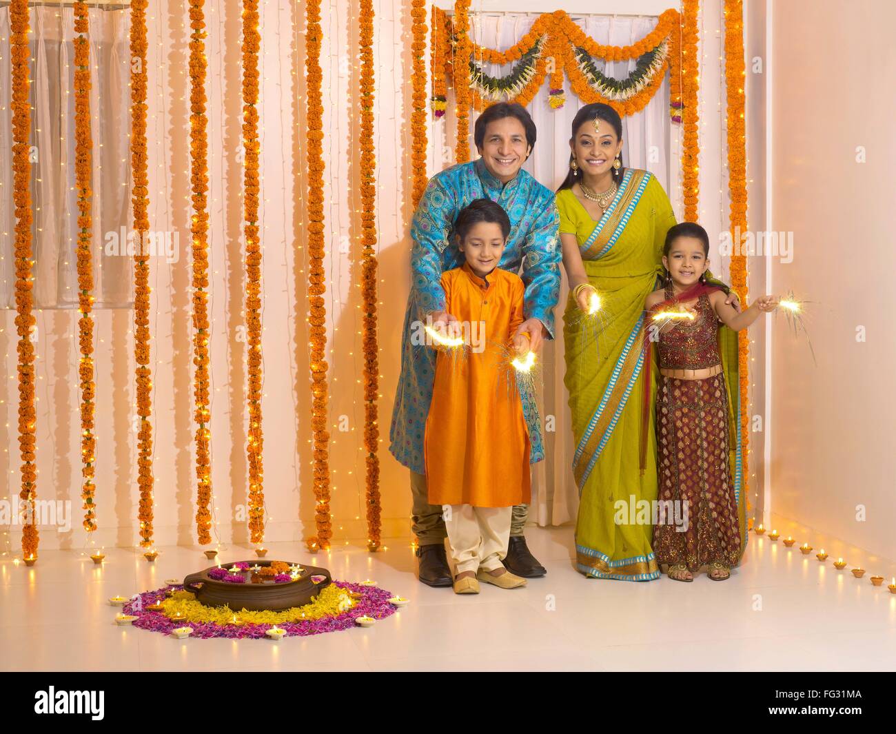Rangoli family hi-res stock photography and images - Alamy