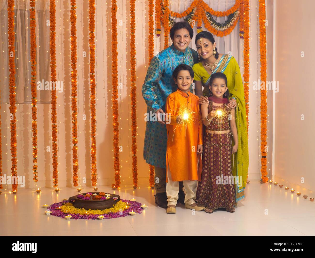 Family celebrates diwali festivals MR#779P ; MR#779Q ; MR#779R ; MR#779S Stock Photo