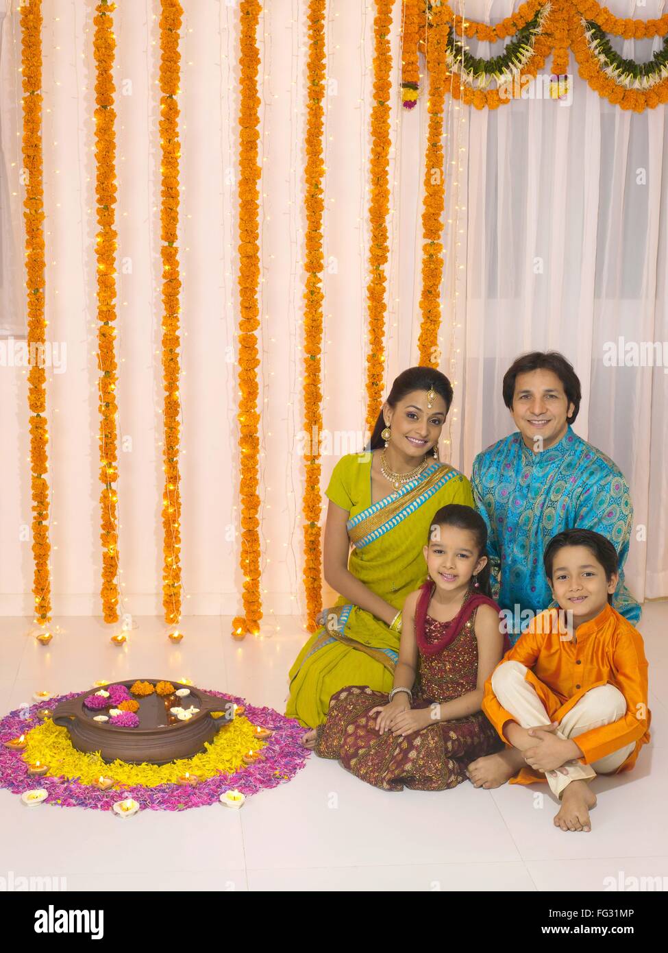 Parent with children in traditional wearing MR#779P ; MR#779Q ; MR#779R ; MR#779S Stock Photo