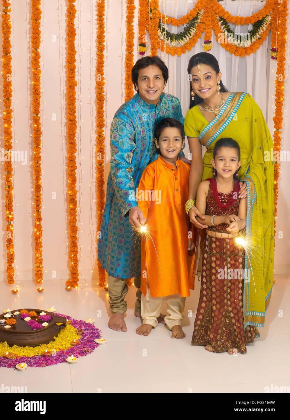 Family celebrates diwali festivals MR#779P ; MR#779Q ; MR#779R ; MR#779S Stock Photo
