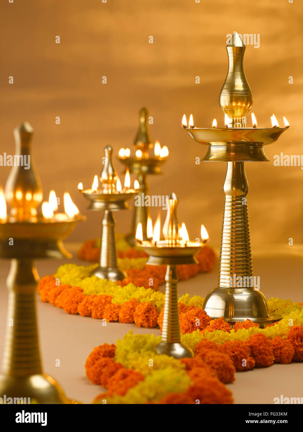 Brass lamps and flowers decoration during diwali festival ; India Stock Photo