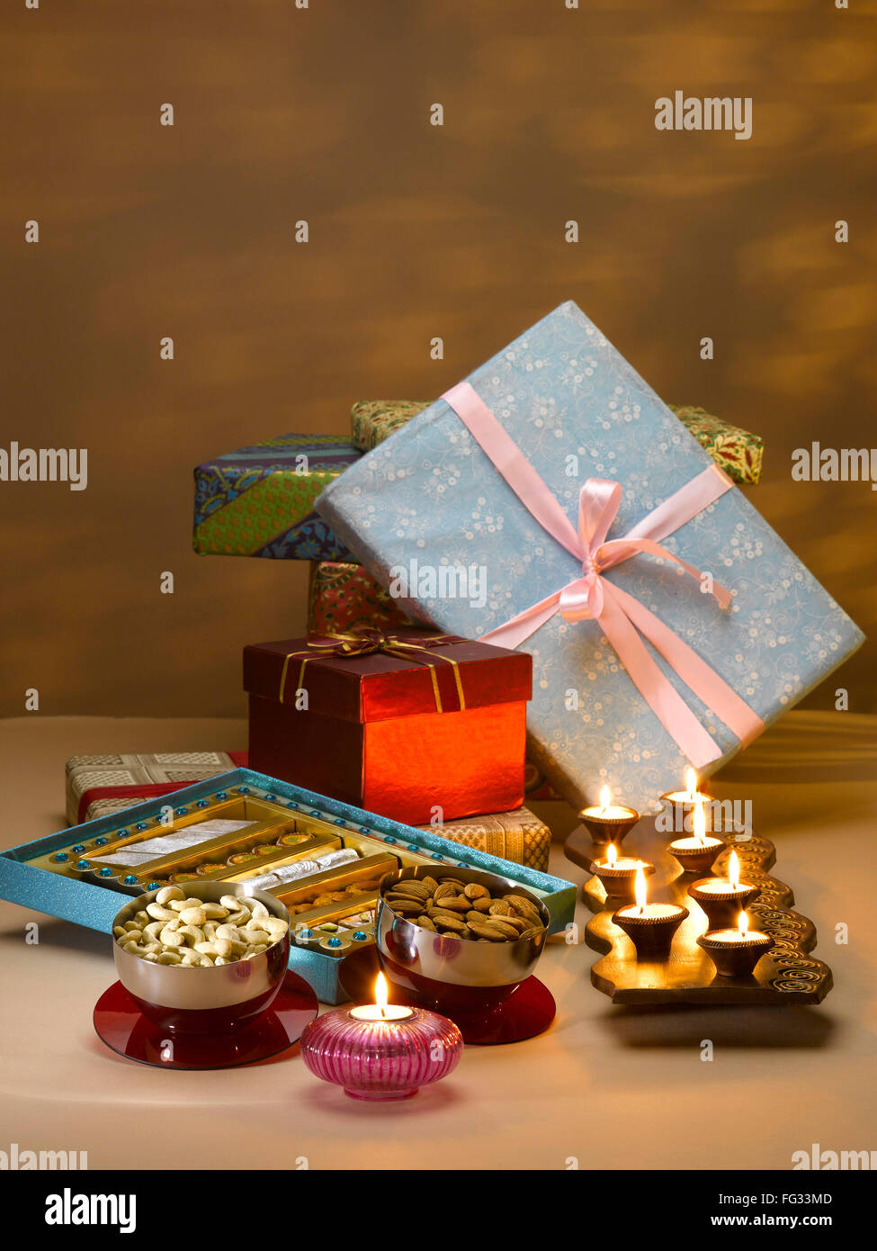 Gifts box ; sweets ; dry fruits and oil lamps for diwali festival ; India Stock Photo