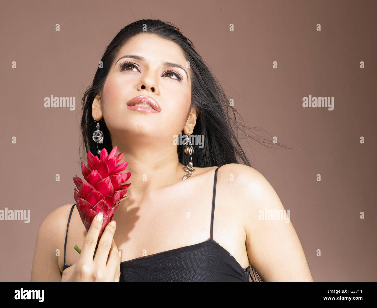 South Asian Indian woman holding ginger flower MR 702 Stock Photo Alamy