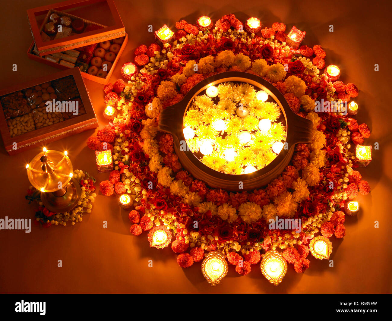 Diyas and flowers arrangement for Diwali festival of lights Stock Photo