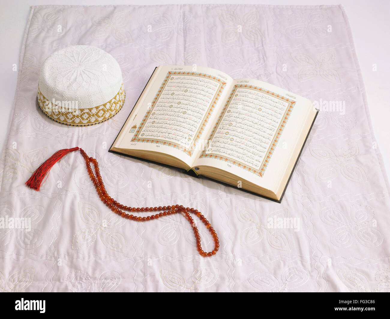 Koran prayer beads shawl mass Allah bohri Muslim topi cap eid ul fitr or id ul fitr for Id festival Stock Photo